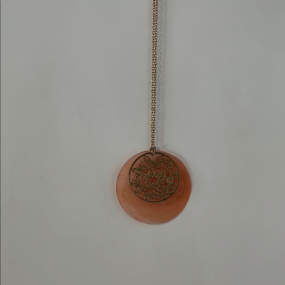 Orange Pendant Necklace with Intricate Design